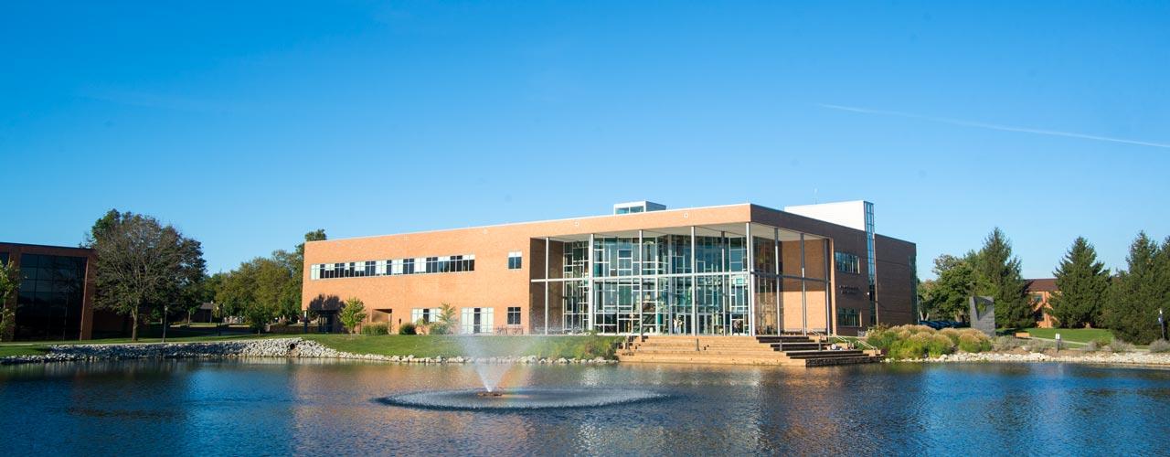 The Biblical and Theological Studies building sits by Cedar Lake