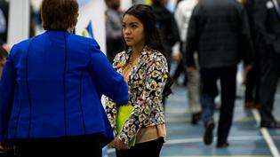 A female student talks with a potential employer at one of Cedarville's career fairs